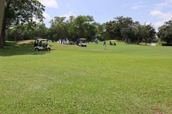 Greenwood Golf Club 2 people people golfing golf cart golf course and grass