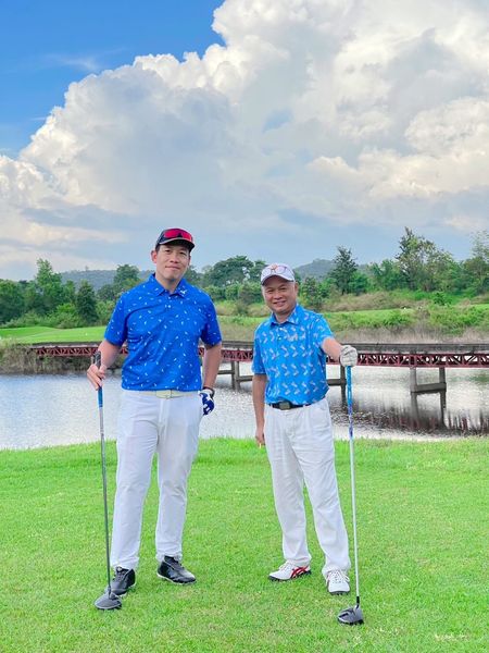 2 people golf course and grass 2 people golf course and grass