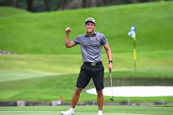 1 person playing a sport grass golf course and PING