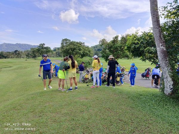 Phuket Country Club 10 people people standing tree and grass Phuket Country Club 10 people people standing tree and grass