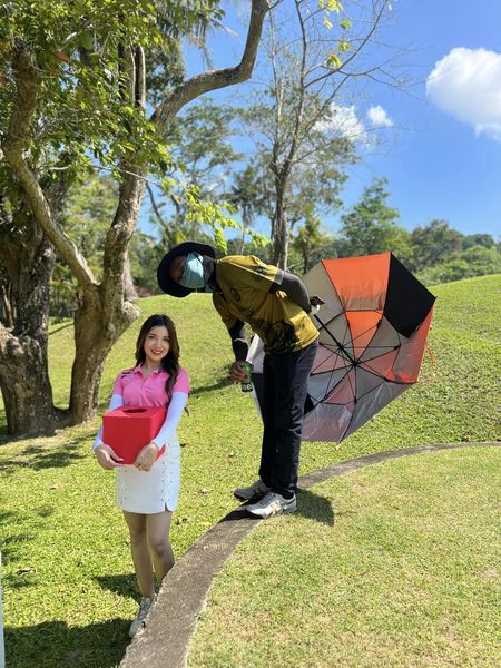Phuket Country Club 2 people people standing outdoors and tree Phuket Country Club 2 people people standing outdoors and tree