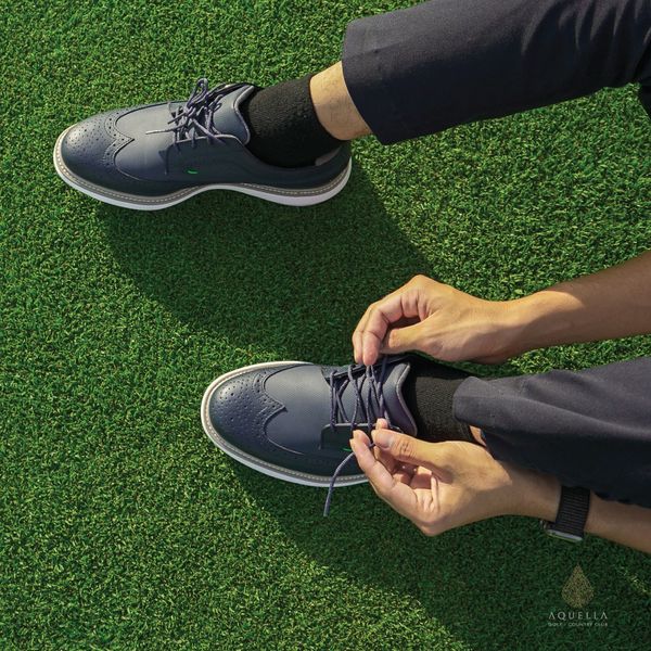 Aquella Golf amp Country Club golf wingtip shoes and grass