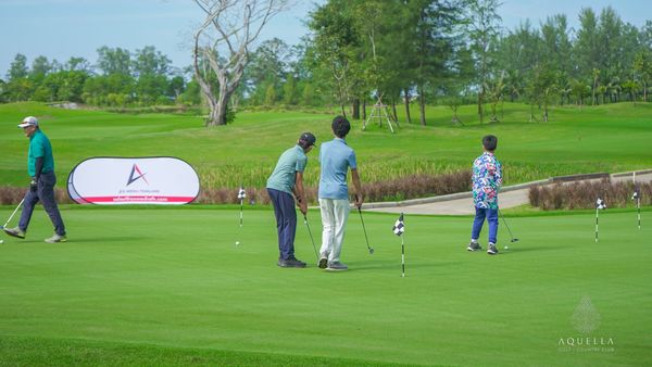 Aquella Golf amp Country Club 4 people people golfing golf course and text