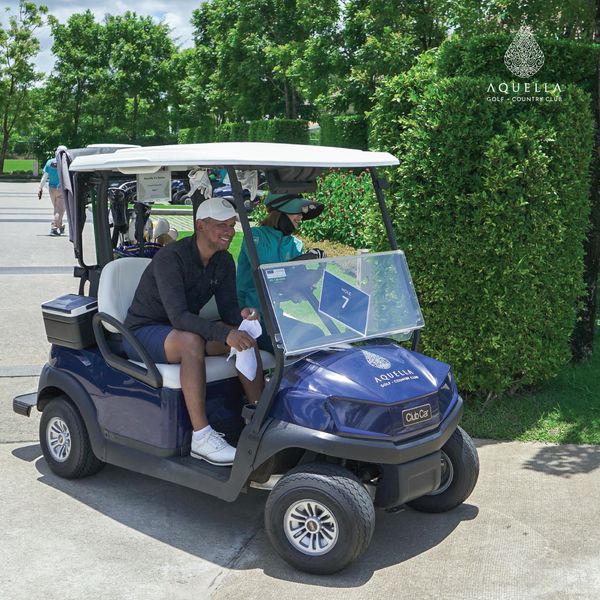 Aquella Golf amp Country Club 3 people people golfing golf cart golf course and text