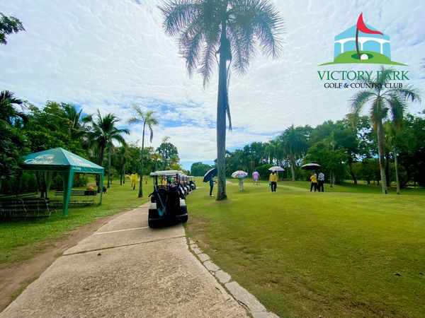Victory Park Golf amp Country Club 5 people people golfing golf cart golf course and text