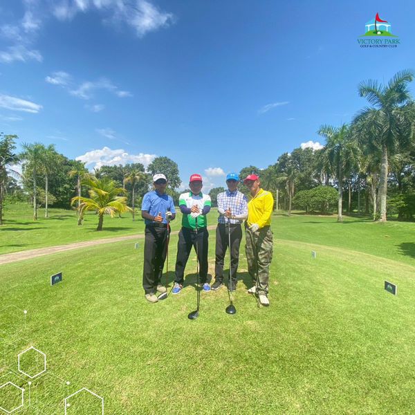 Victory Park Golf amp Country Club 4 people people golfing golf cart grass and golf course